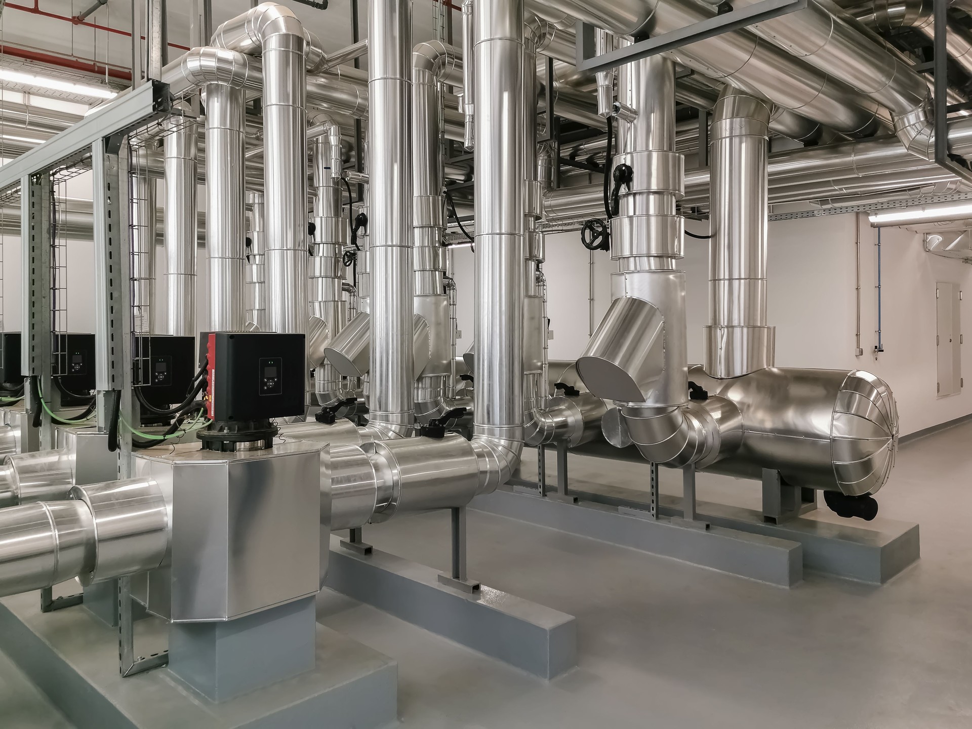 Industrial system with stainless steel ducts, forced ventilation of buildings and industrial equipment, large metallic ducts for air inlet and outlet, air renewal, industrial HVAC system